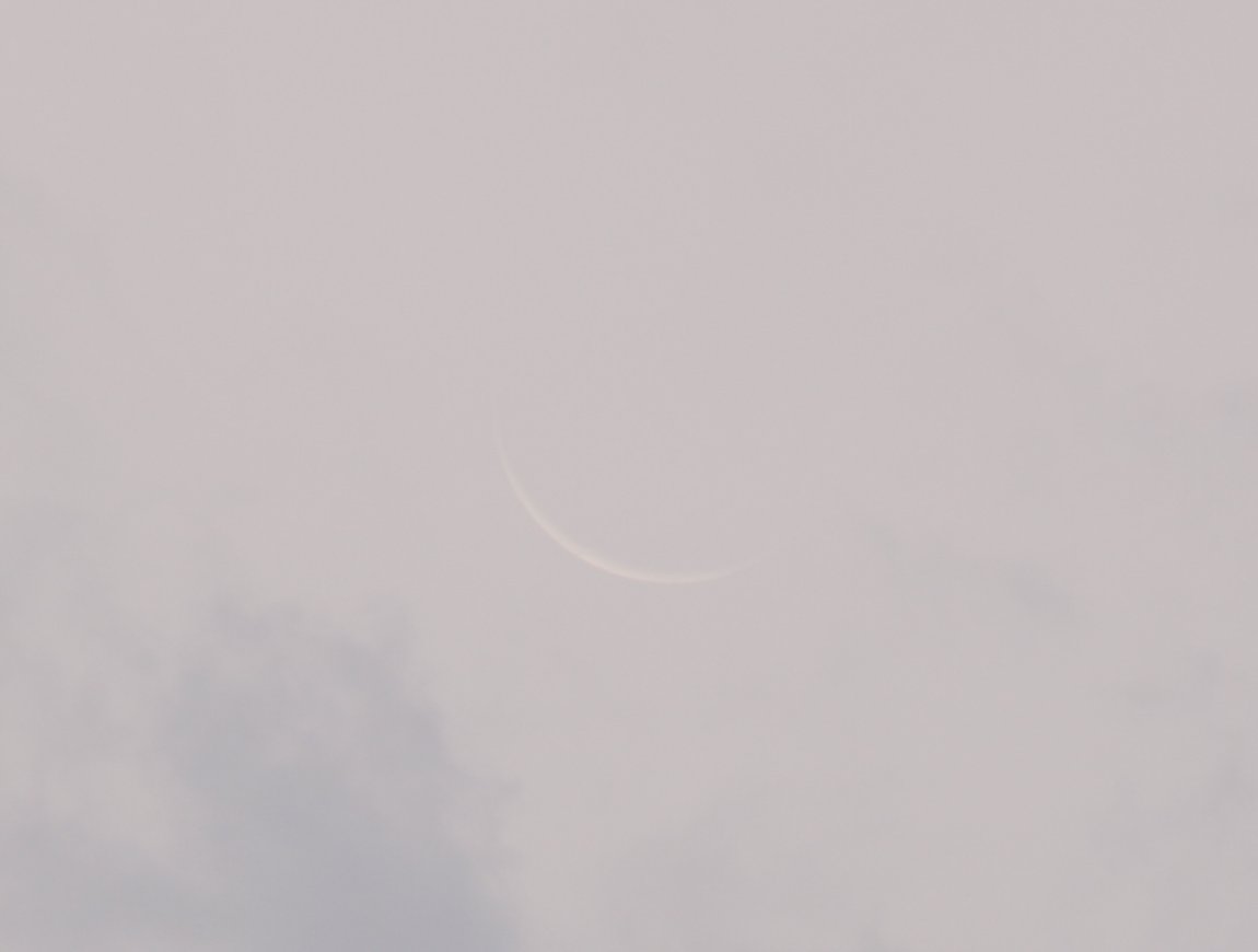 old crescent in clouds